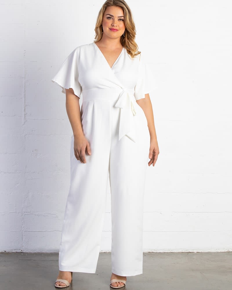 Front of a model wearing a size 0X Karina Crepe Jumpsuit in IVORY by Kiyonna. | dia_product_style_image_id:227488